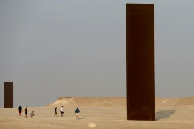 Two of the four steel slabs of US artist Richard Serra's "East-West/West-East" installation in the Qatari desert