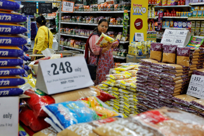 A woman looks at an item as she shops at a food superstore in Ahmedabad
