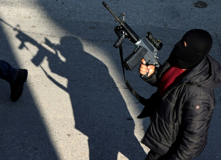 Palestinian gunmen attend the funeral of Naim Jamal Zubaidi, 27, and Muhammad Ayman al-Saadi, 26, in Jenin, in the Israeli-occupied West Bank