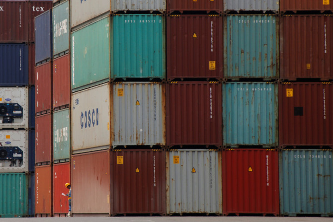 A laborer works in a container area at a port in Tokyo