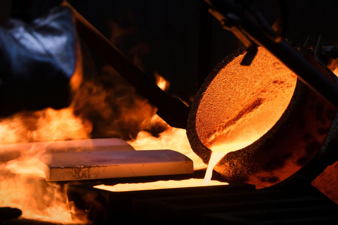 An ingot of 99.99 percent pure gold is cast at the Krastsvetmet non-ferrous metals plant in Krasnoyarsk