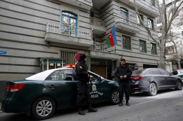 Police stand guard in front of the Azerbaijan embassy in Tehran following Friday's attack