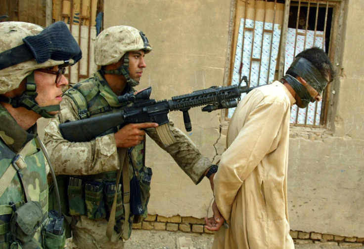 US Marines arrest an Iraqi man during a house-to-house search in the Jolan district of the restive city of Fallujah, in this file photo from November 12, 2004