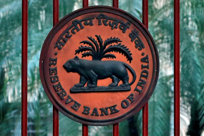Reserve Bank of India logo is seen at the gate of its office in New Delhi