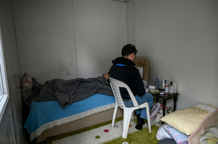 Volunteer psychiatrist Eralp Turk tries to help quake survivors cope with post-traumatic stress