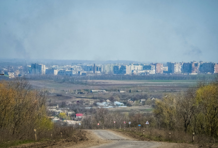 Smoke is seen during a shelling on the outskirts of the front line city of Bakhmut