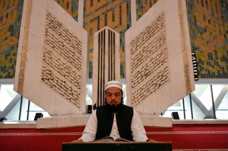 Noor ul Islam recites Koran at the grand Faisal Mosque during Ramadan in Islamabad