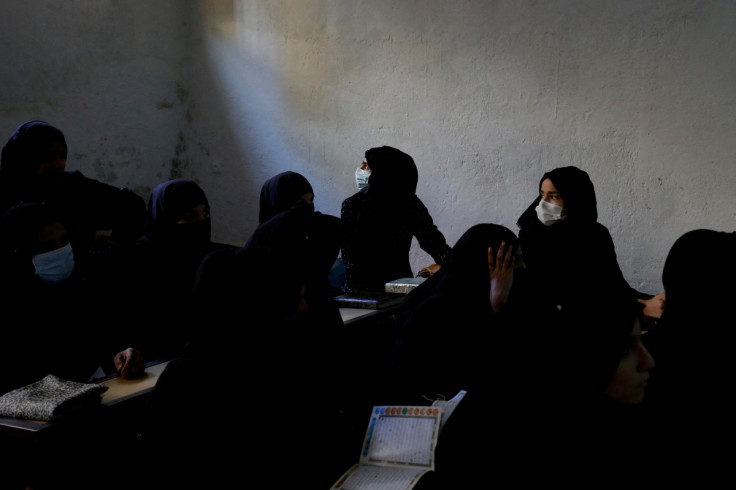 Afghan women learn how to read the Koran in a madrasa or religious school in Kabul