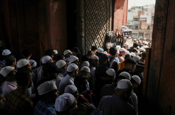 Devotees leave the Jama Masjid mosque in the old quarters of Delhi
