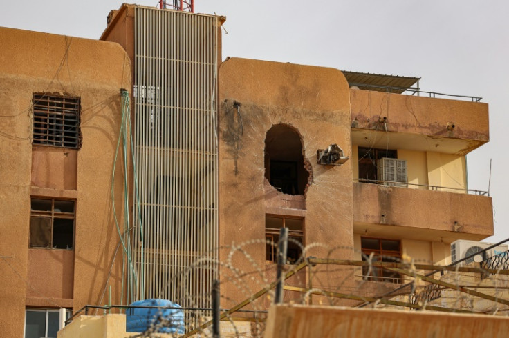 A hole from an explosion is left on the side of a building in Khartoum on April 18