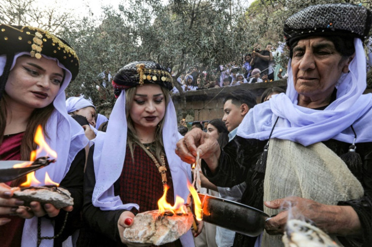 Members of Iraq's Yazidi minority celebrate New Year at a holy shrine in northern Iraq