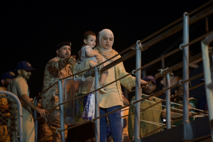 Nearly 200 people from more than 20 countries disembarked from a naval frigate in the Saudi city of Jeddah Monday night after a daring escape from Sudan