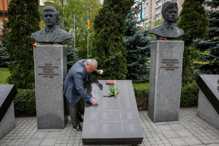 Local residents attend a ceremony marking the 37th anniversary of the disaster at the Chornobyl Nuclear Power Plant in Kyiv