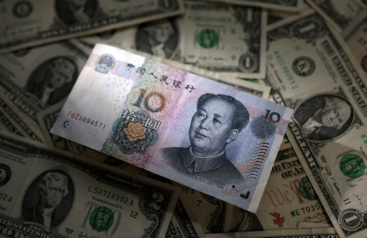 Illustration shows Chinese Yuan and U.S. dollar banknotes