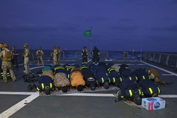 Saudi naval and special forces perform morning prayers aboard HMS Al-Diriyah during the evacuation operation from Port Sudan to Jeddah