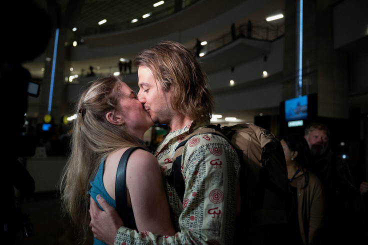 South Africans evacuated from Sudan to escape the conflict arrive at O.R. Tambo International Airport, in Johannesburg