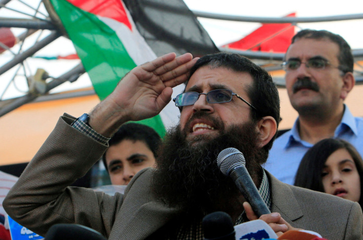 Palestinian Islamic Jihad leader Khader Adnan gestures as he speaks during a rally honoring him following his release, near the West Bank city of Jenin