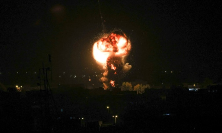 A fireball rises over the Gaza town of Rafah after Israel carries out a pre-dawn air strike, hours before Palestinian militant group Islamic Jihad announces a truce