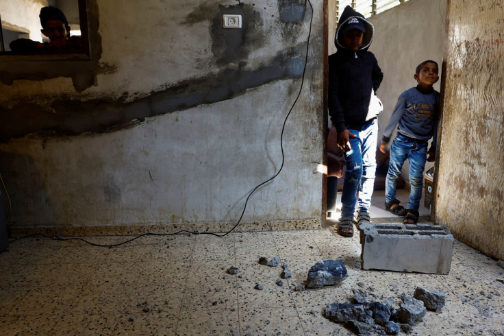 Palestinian relatives grieve during the funeral of a man who was killed during an Israeli airstrike in Gaza
