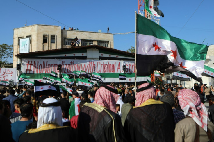 Syrians demonstrate in the rebel-held northwestern city of Idlib against resuming ties with Assad's government
