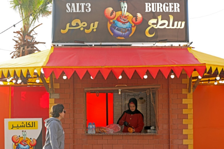 Unable to find work, Amani Shaath opened her own Gaza seafront kiosk to sell hamburgers