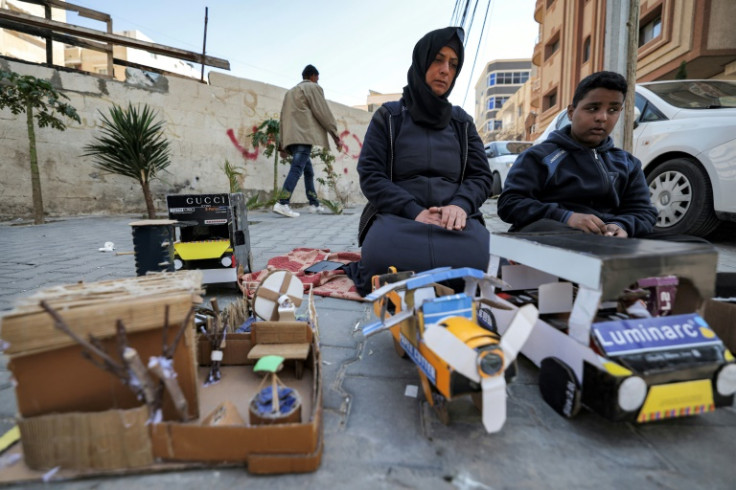 Islam Abu Taima and her son sell the creations at al-Shati camp for Palestinian refugee -- but it's not enough to pay their rent