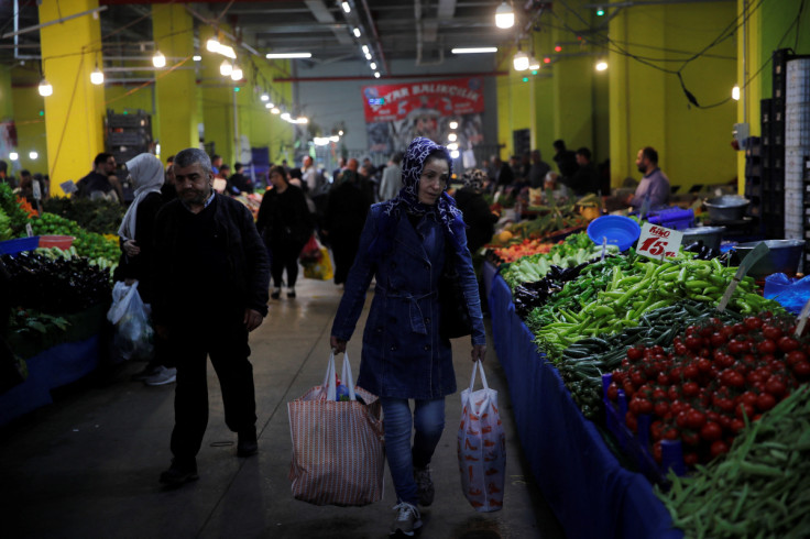 People shop at a fresh market in Istanbul