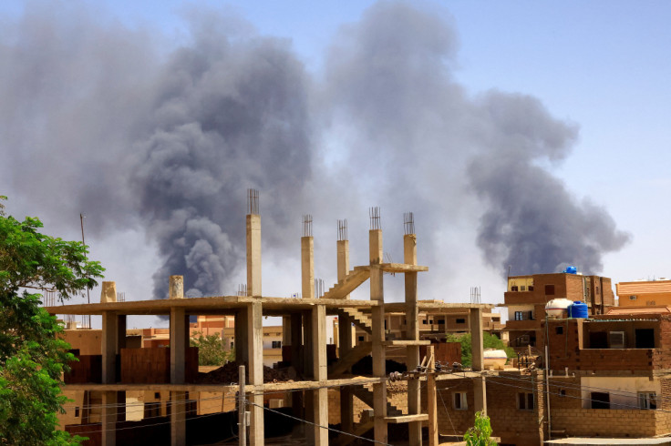 Smoke rises above buildings after an aerial bombardment in Khartoum North