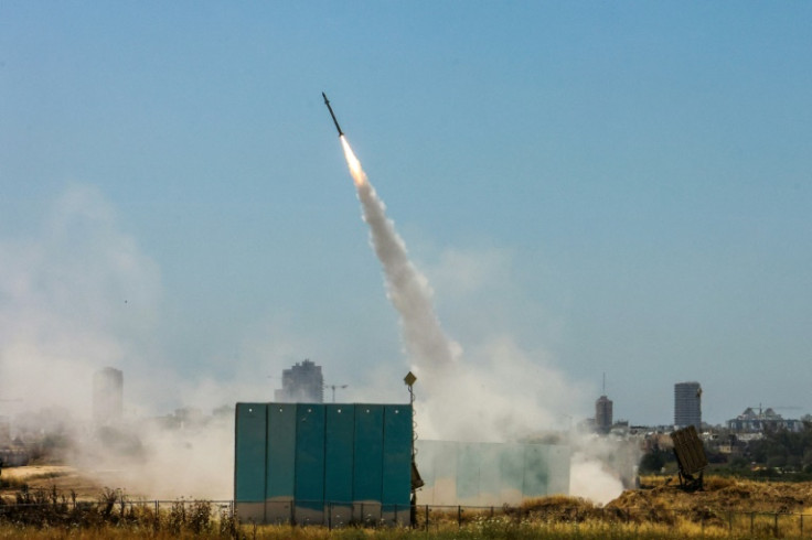 Israeli air defences respond as more than 60 rockets are fired from Gaza towards Israeli population centres, including Tel Aviv