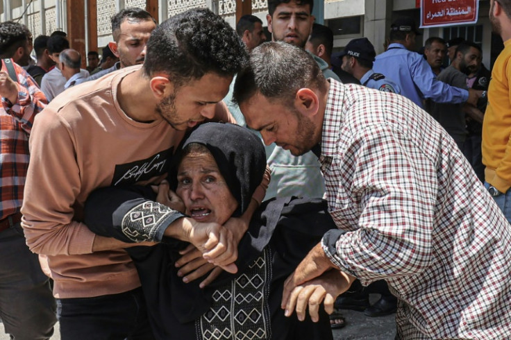 Relatives mourn outside the morgue of a hospital in Khan Yunis, Gaza, on May 10, 2023 following the death of Palestinian Muhammad Abu Taima in an Israeli strike