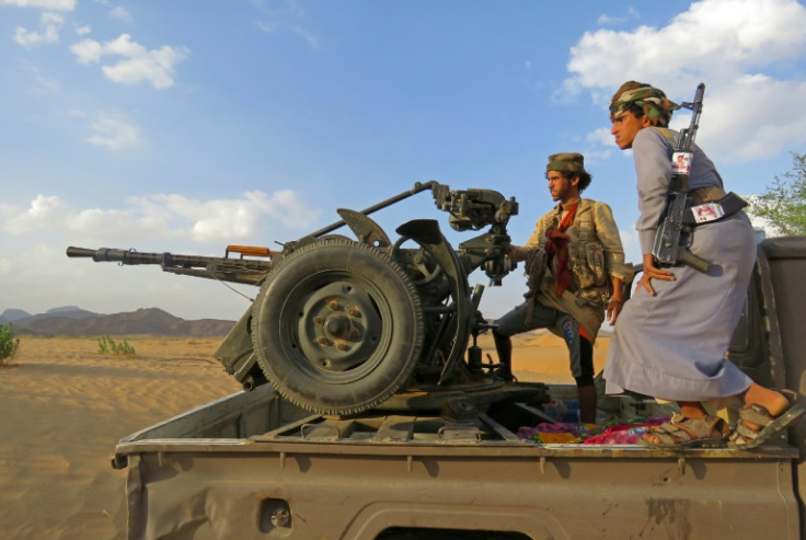 Fighters loyal to Yemen's Saudi-backed government man a position near al-Jawba front line, facing Iran-backed Huthi rebels, in the northeastern province of Marib