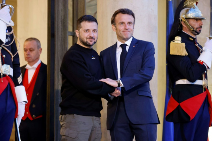Ukraine's President Volodymyr Zelensky (L) met with France's President Emmanuel Macron (C) at the Elysee presidential palace in Paris