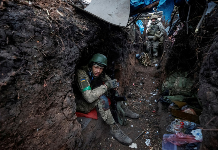 Ukrainian servicemen rest after a fight near the front line city of Bakhmut