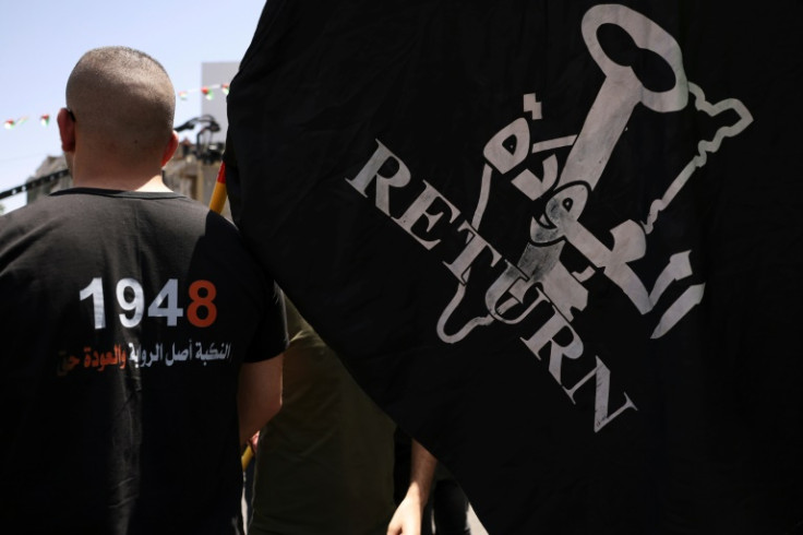 Protesters in Ramallah waved Palestinian flags and carried black banners that read 'Return'
