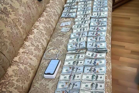 Money found by anti-corruption detectives during investigative actions in a corruption case involving judges of the Supreme Court is depicted in an unknown location in Ukraine