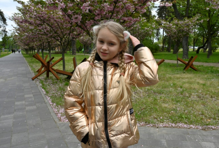Since Russia's invasion, eight-year-old Ukrainian Dana has begun asking potential playmates where they are from
