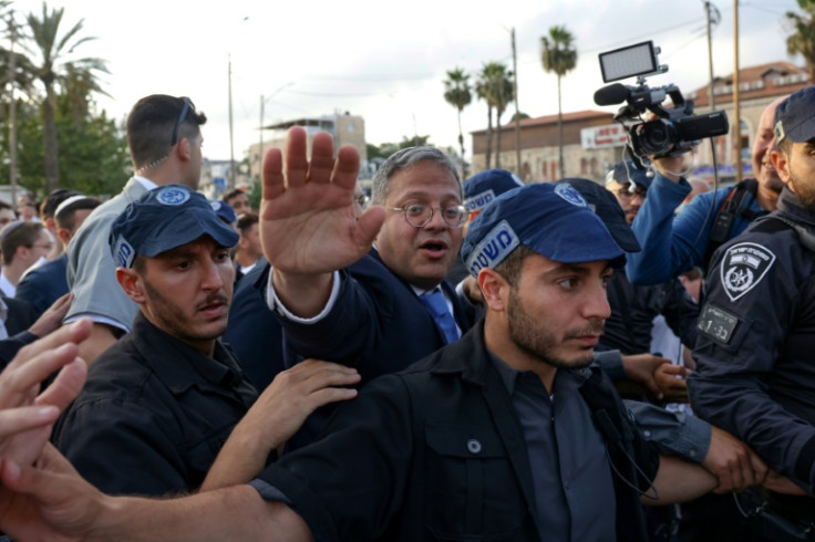 Flanked by a police escort, far-right National Security Minister Itamar Ben-Gvir visited the Al-Aqsa mosque before the march