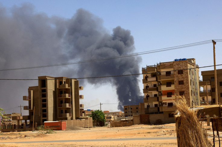 Smoke rises above buildings after an aerial bombardment in Khartoum North