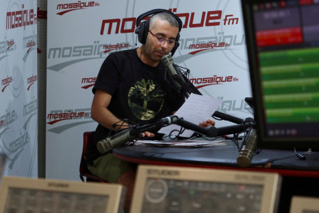 Tunisia police to investigate two top journalists, radio station says