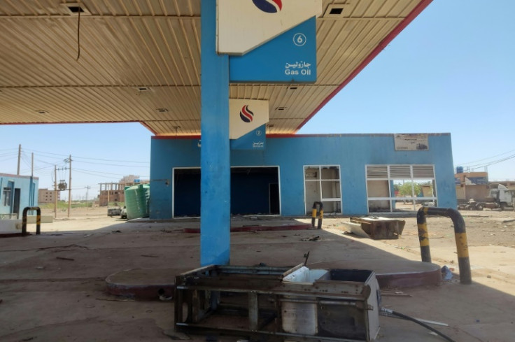 A broken and looted petrol station in southern Khartoum -- even if truckers find fuel, they must pay inflated prices