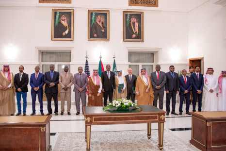 Representatives of the Sudanese army and rival paramilitary Rapid Support Forces sign an agreement for a seven-day ceasefire, in Jeddah
