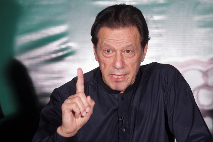 Pakistan's former Prime Minister Imran Khan, gestures as he speaks to the members of the media at his residence in Lahore