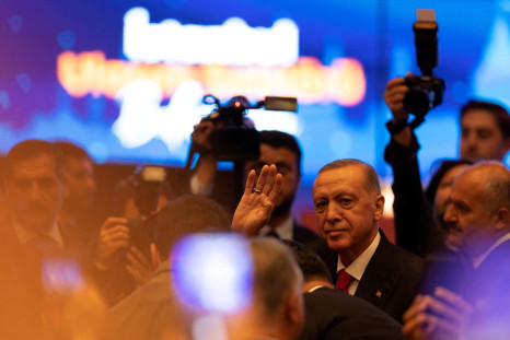 Turkish President Tayyip Erdogan greets his supporters as he arrives for a meeting in Istanbul