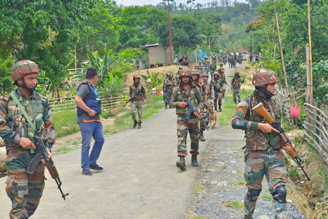 Indian army soldiers patrol during a security operation in hill and valley areas in Manipur