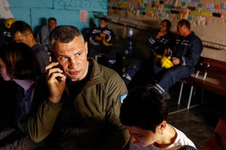 People take cover inside a shelter during an air raid alert in Kyiv