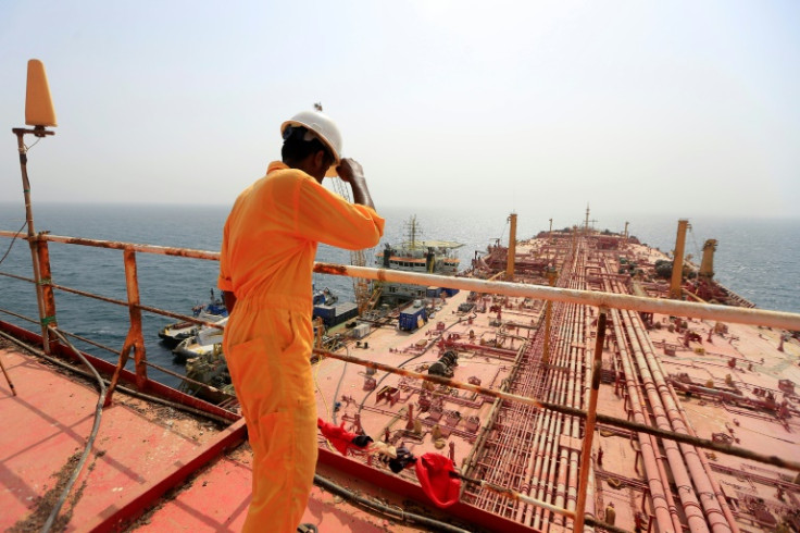 A man stands on the deck of the beleaguered FSO Safer oil tanker, in the Red Sea off the coast of Yemen ahead of operations to remove more than a million barrels of oil from the vessel