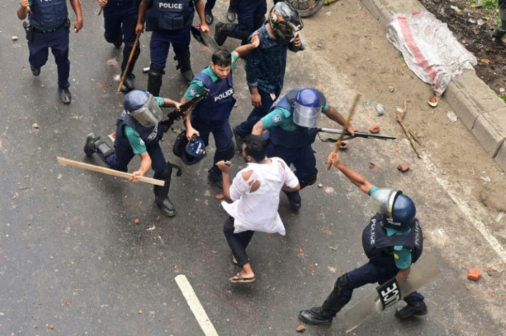 Bangladesh police fired rubber bullets and tear gas to disperse stone-throwing crowds blockading major roads in the capital Dhaka
