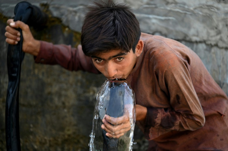 A boy drinks water in Jacobabad, Pakistan -- one of the few places that have seen wet bulb temperatures soar over 35C