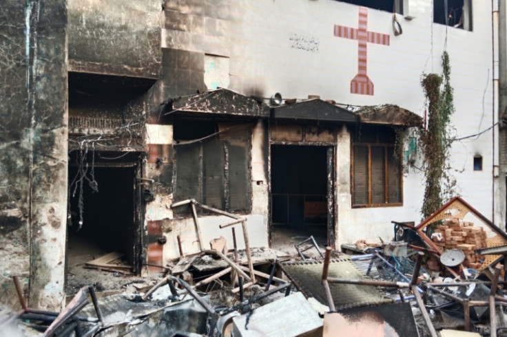 View of a burnt church on the outskirts of Faisalabad, Pakistan, on August 16, 2023, following an attack by Muslim men after Christians were accused of blasphemy