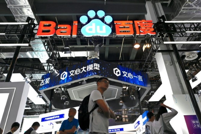Visitors walk past the Baidu booth during the World Artificial Intelligence Conference (WAIC) in Shanghai